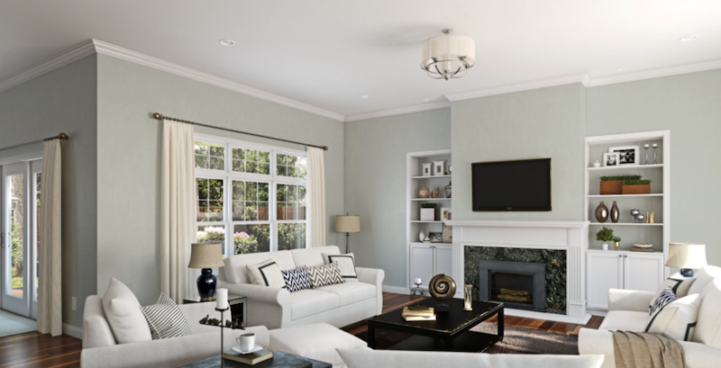 Artisan peintre en bâtiment en train de peindre un mur